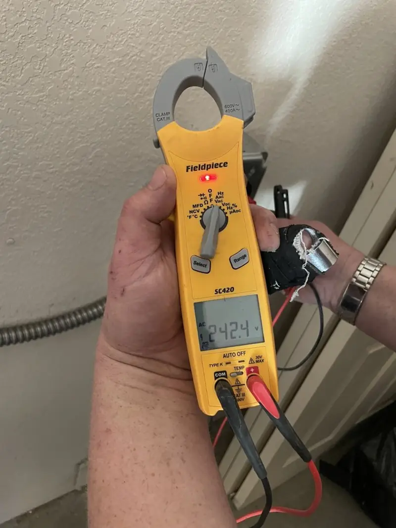 Voltage testing with clamp meter during Ceiling Fan Installation in Winnsboro